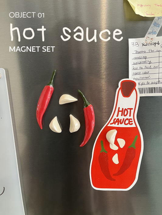 Hot Sauce magnet set on a fridge